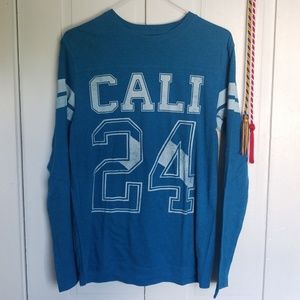 blue long-sleeved tee with logo